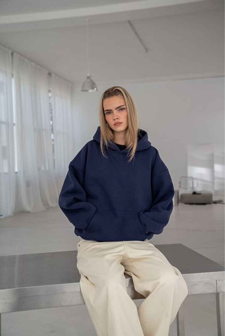 womens-oversized-navy-blue-hoodie-standing-front-view.jpg.jpg